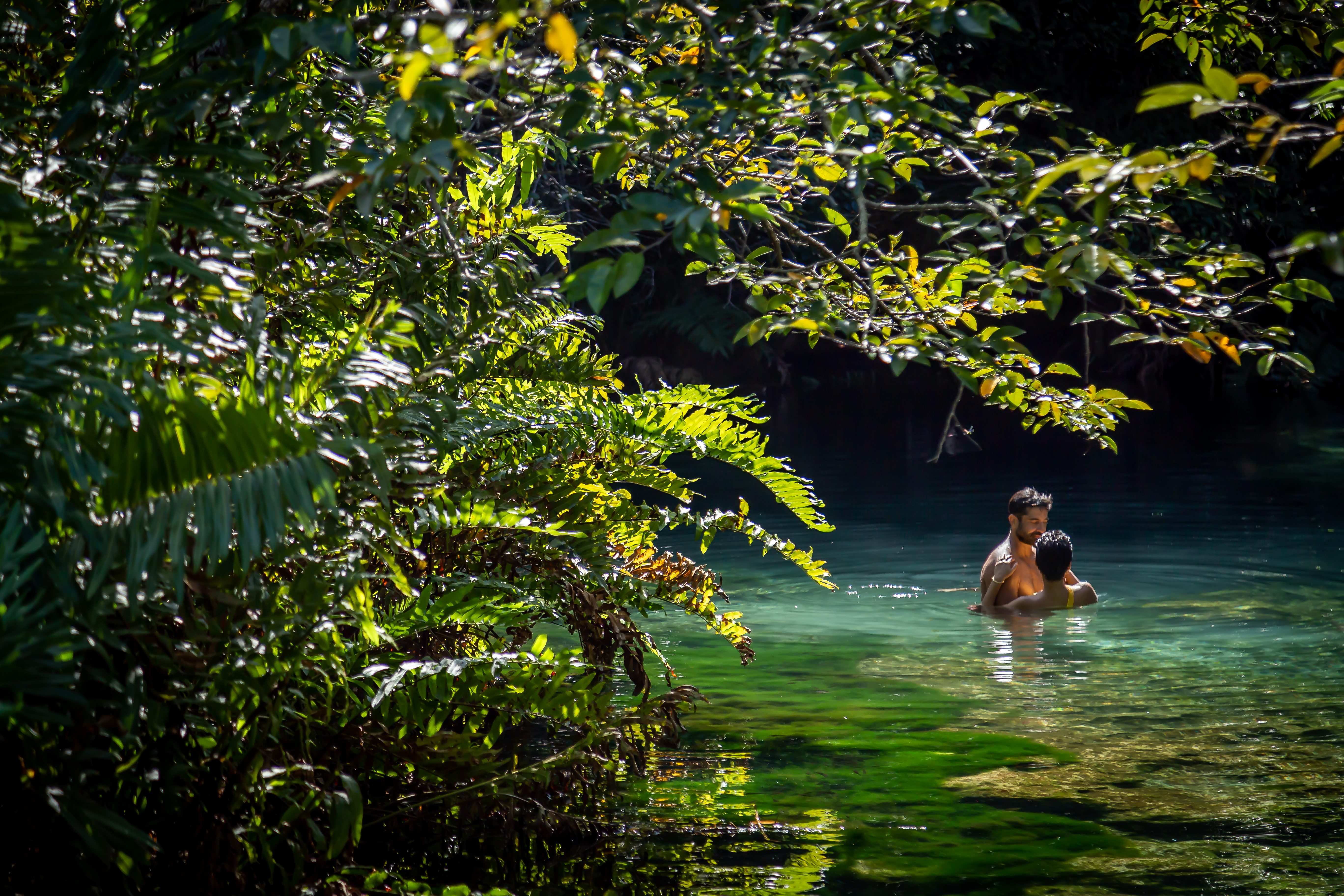 a man and woman in water