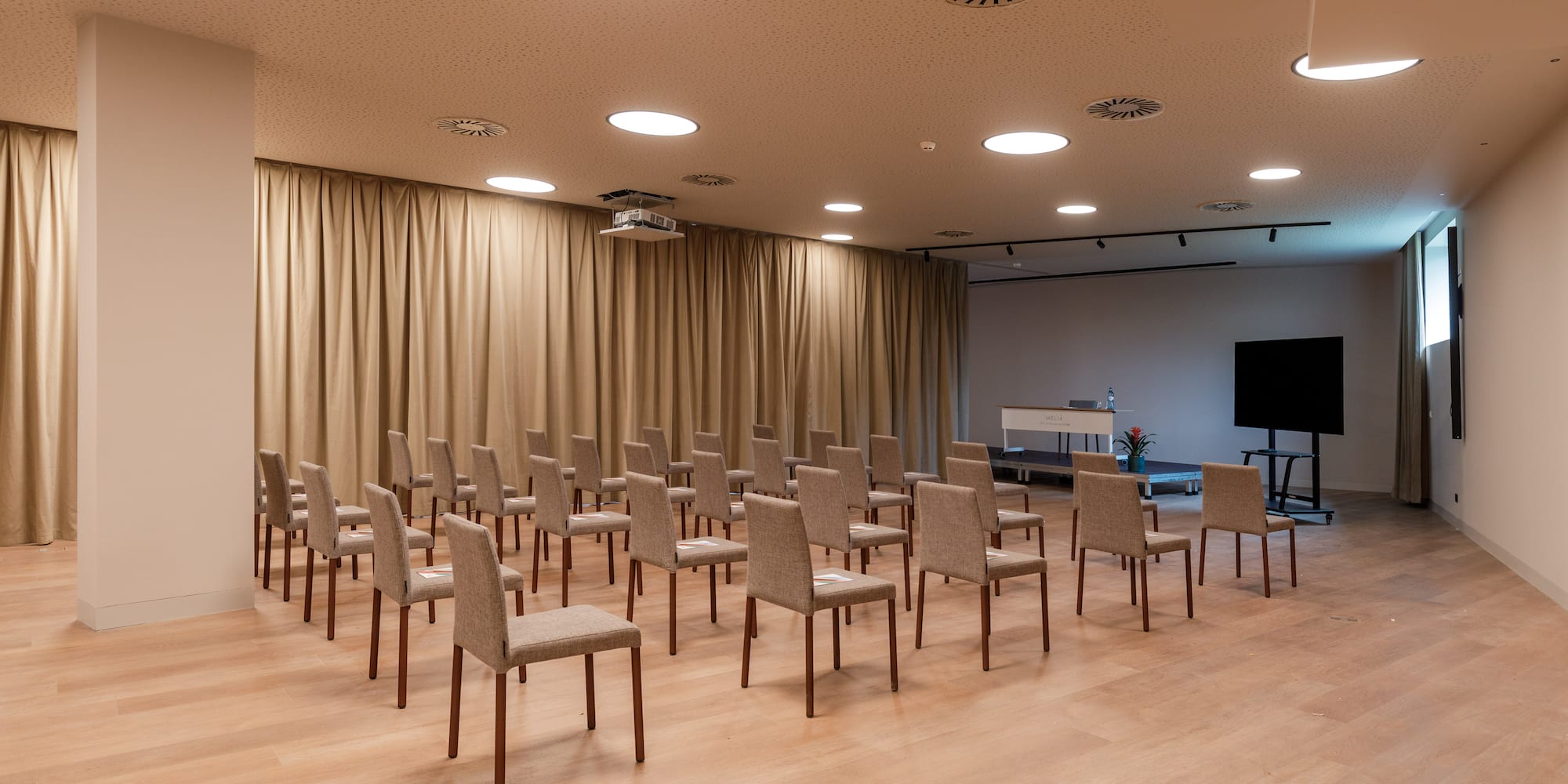 a room with chairs and a projector