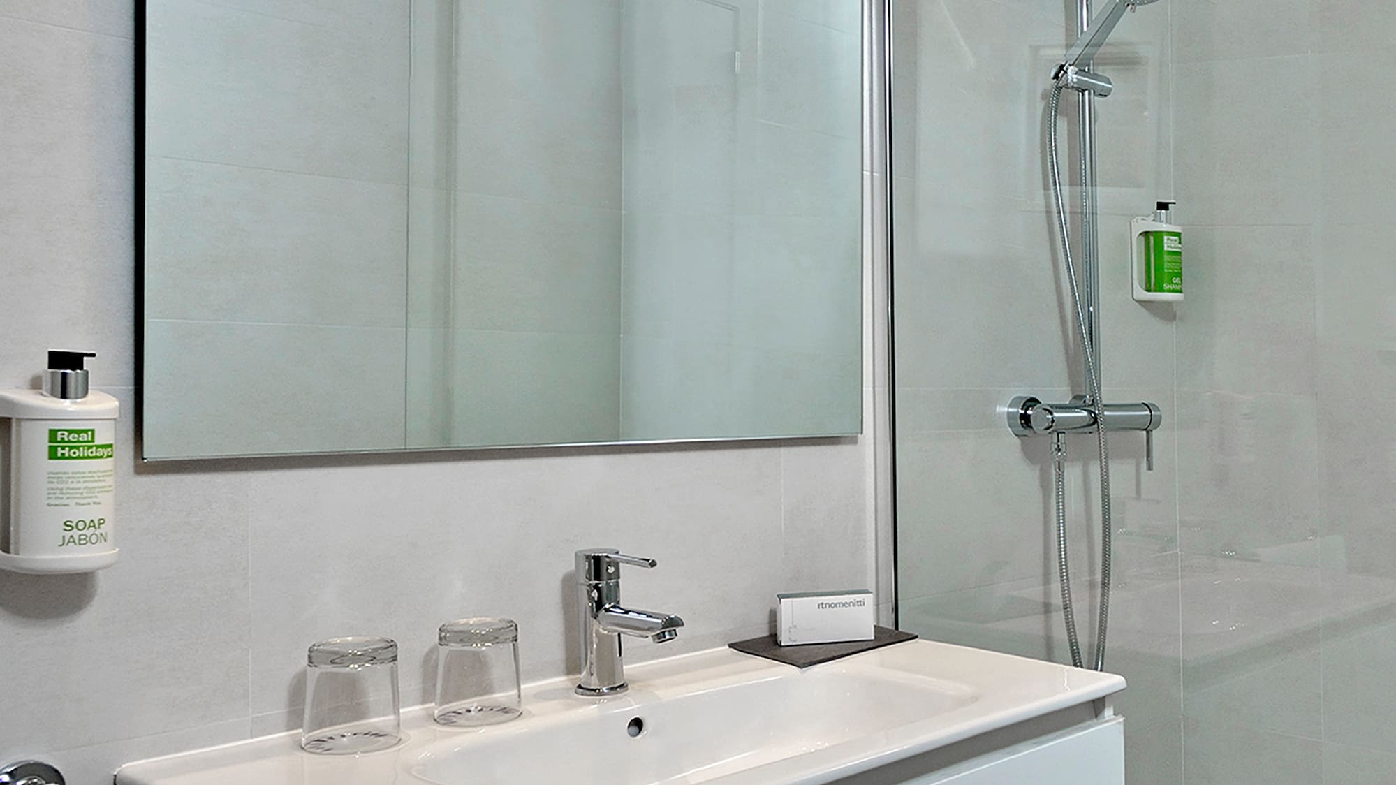 a bathroom with a shower and sink