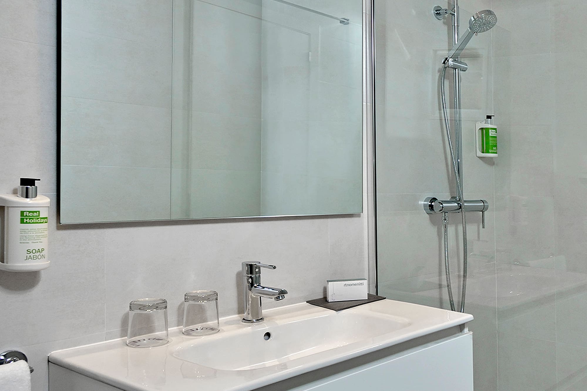 a bathroom with a shower and sink