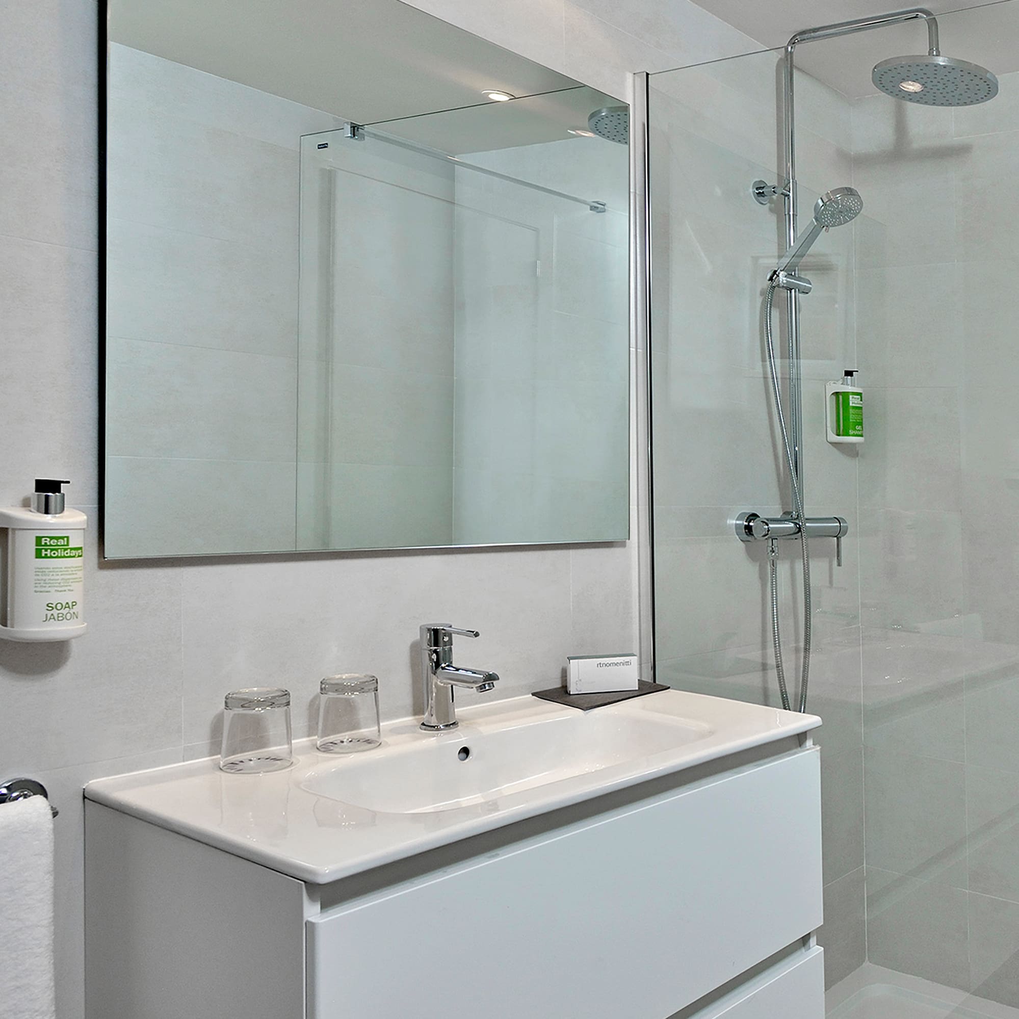 a bathroom with a shower and sink