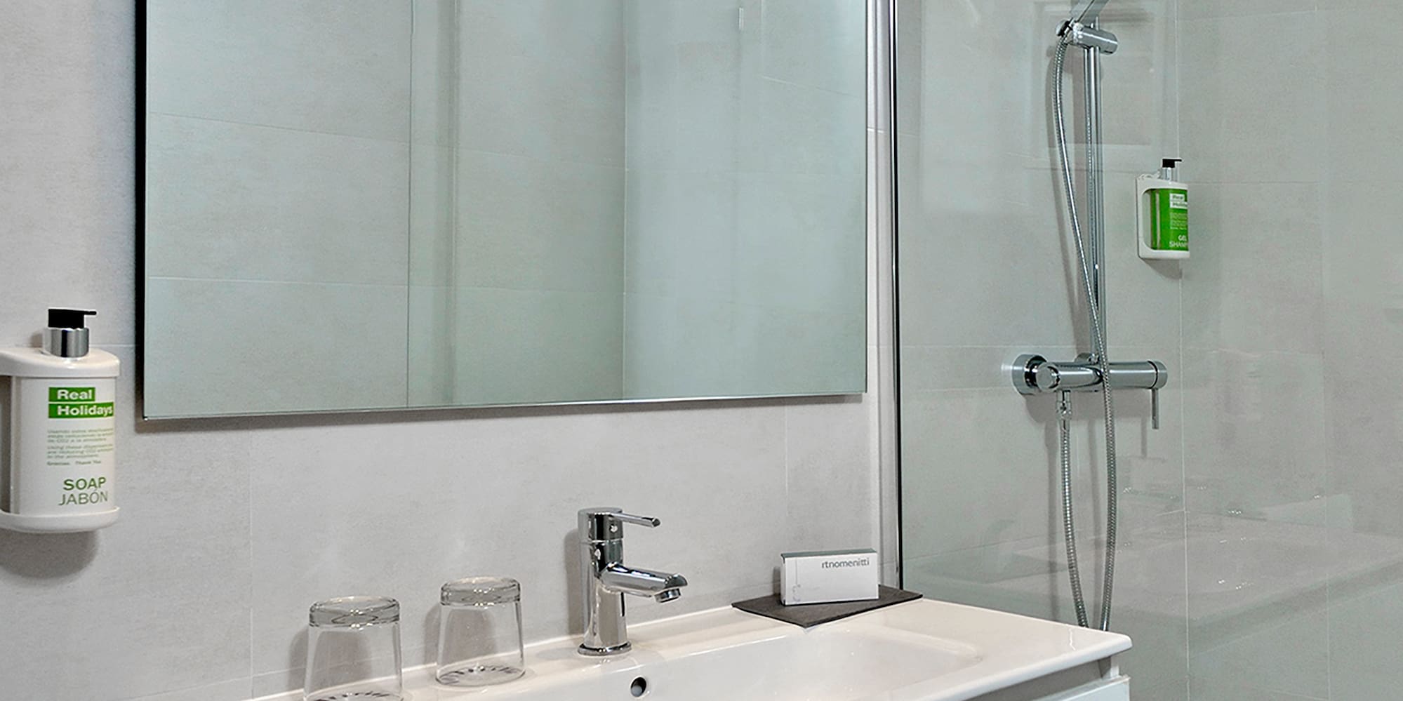 a bathroom with a shower and sink