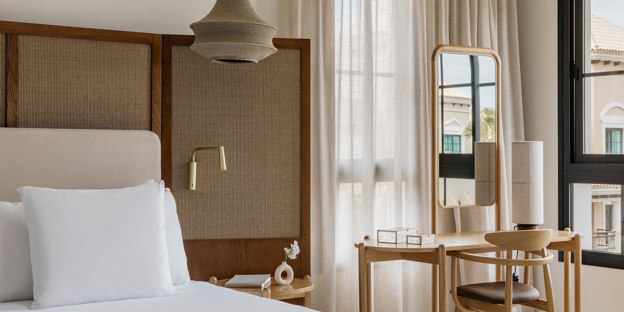 a bedroom with a bed and a mirror