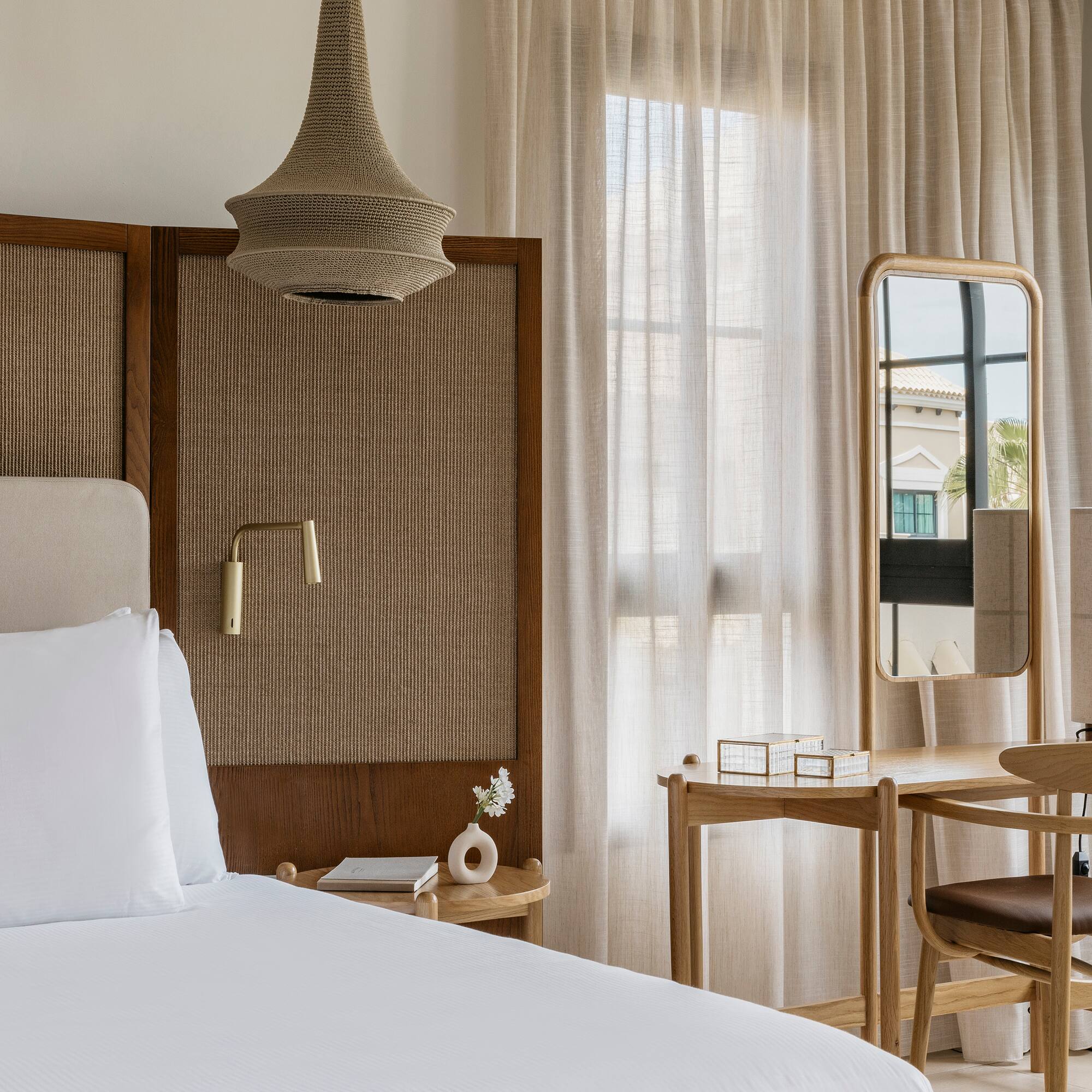 a bedroom with a bed and a mirror