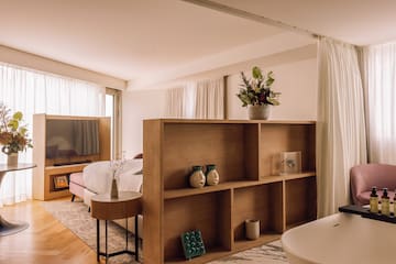 a room with a bed and a tv