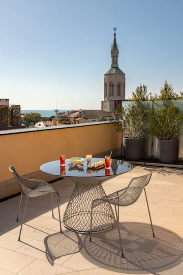 a table and chairs on a rooftop