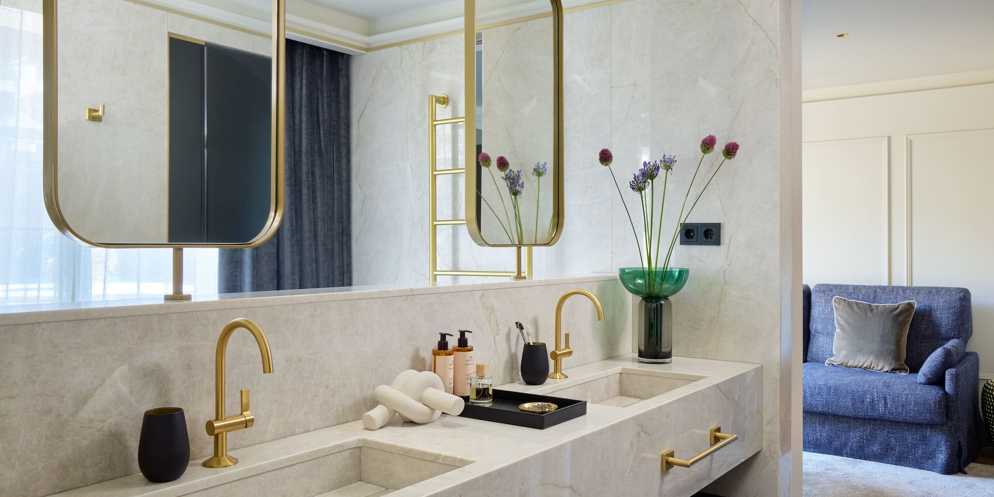 a bathroom with a marble countertop and a mirror