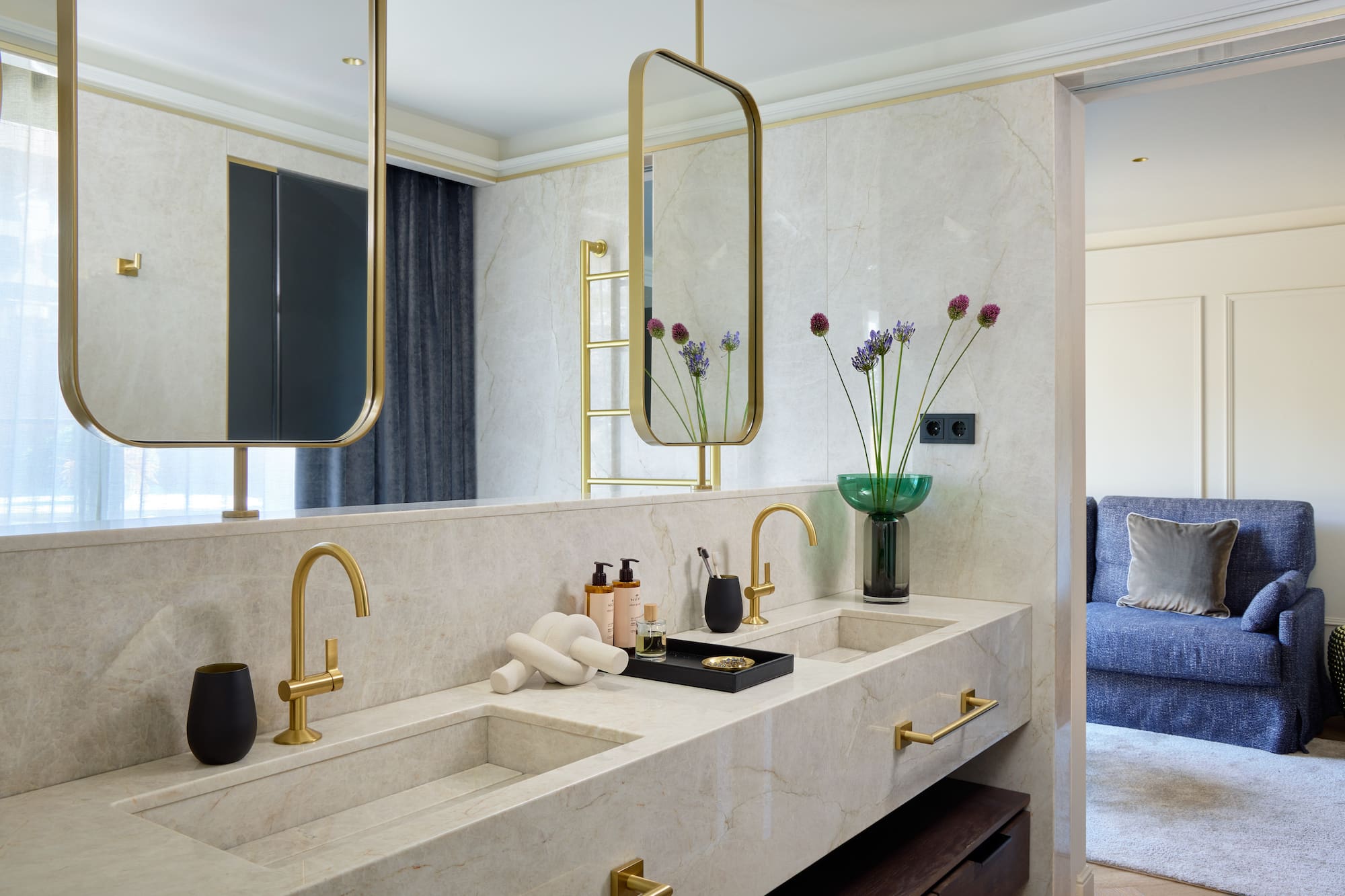 a bathroom with a marble countertop and a mirror