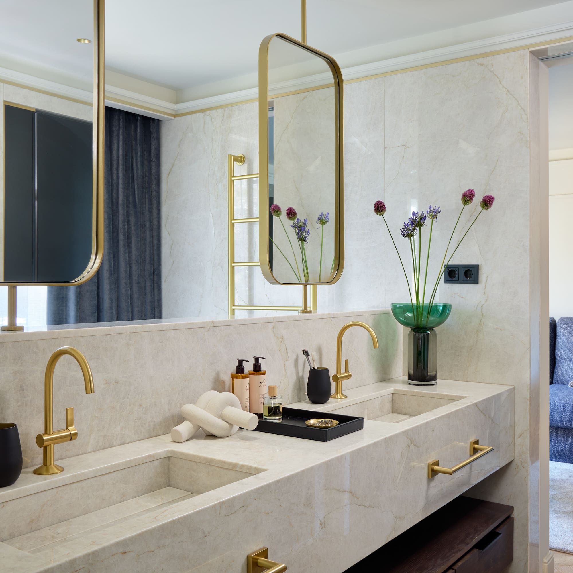 a bathroom with a marble countertop and a mirror