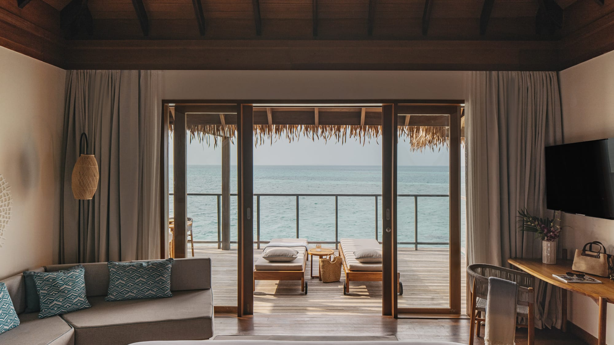 a bedroom with a bed and a bench