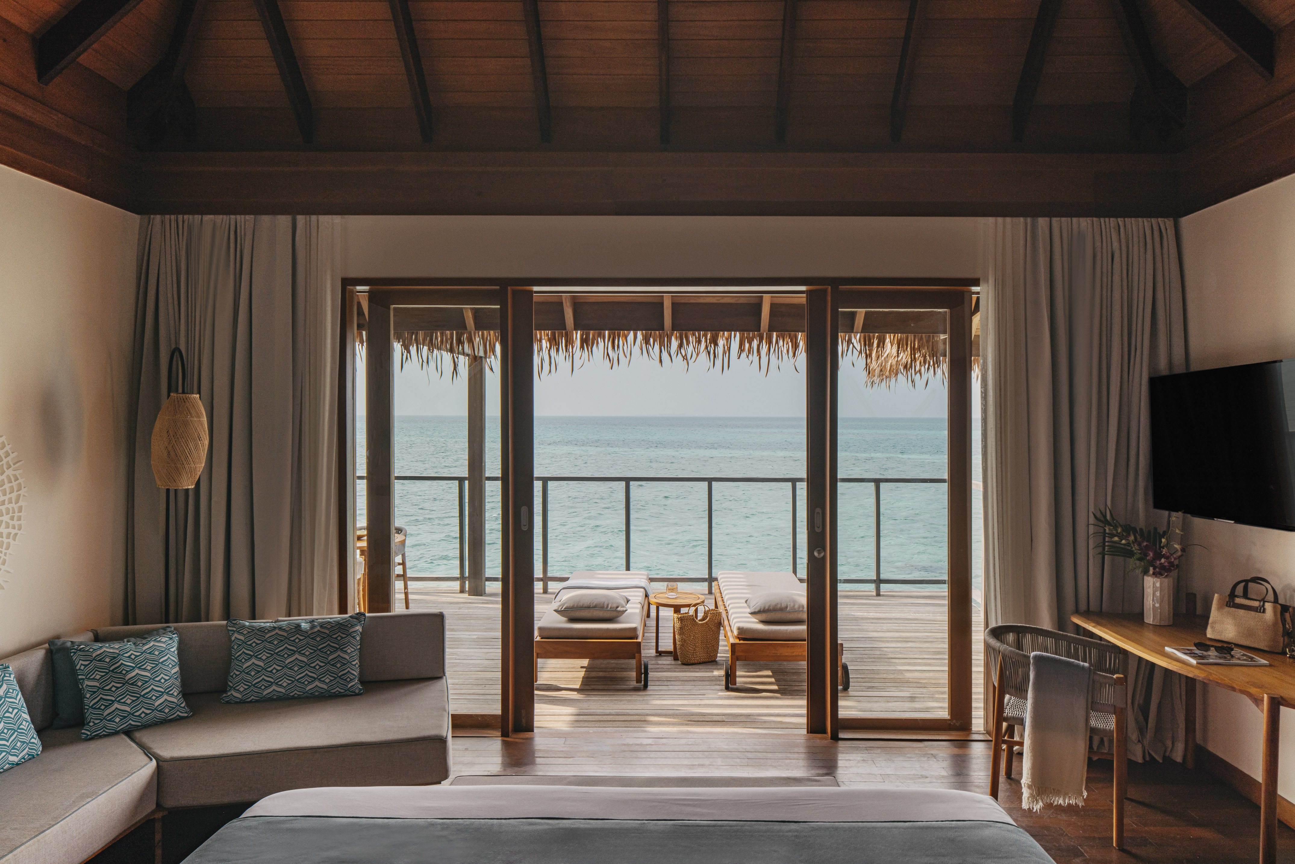 a bedroom with a bed and a bench