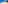 Sunny sandy beach, turquoise ocean, distant coastal town, palm trees, blue sky.