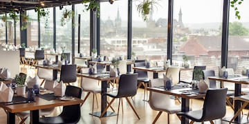 a room with tables and chairs