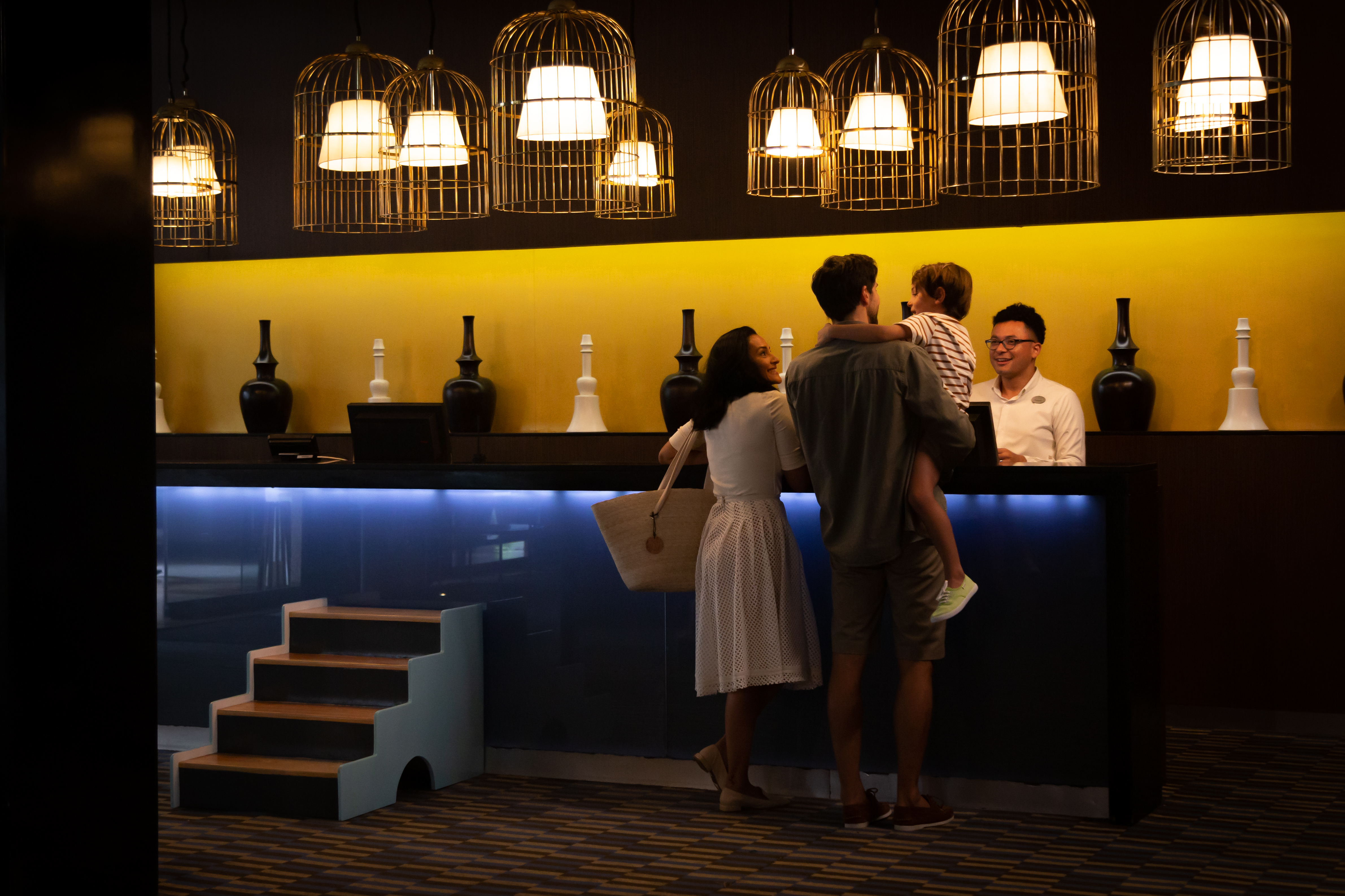 a group of people standing at a counter