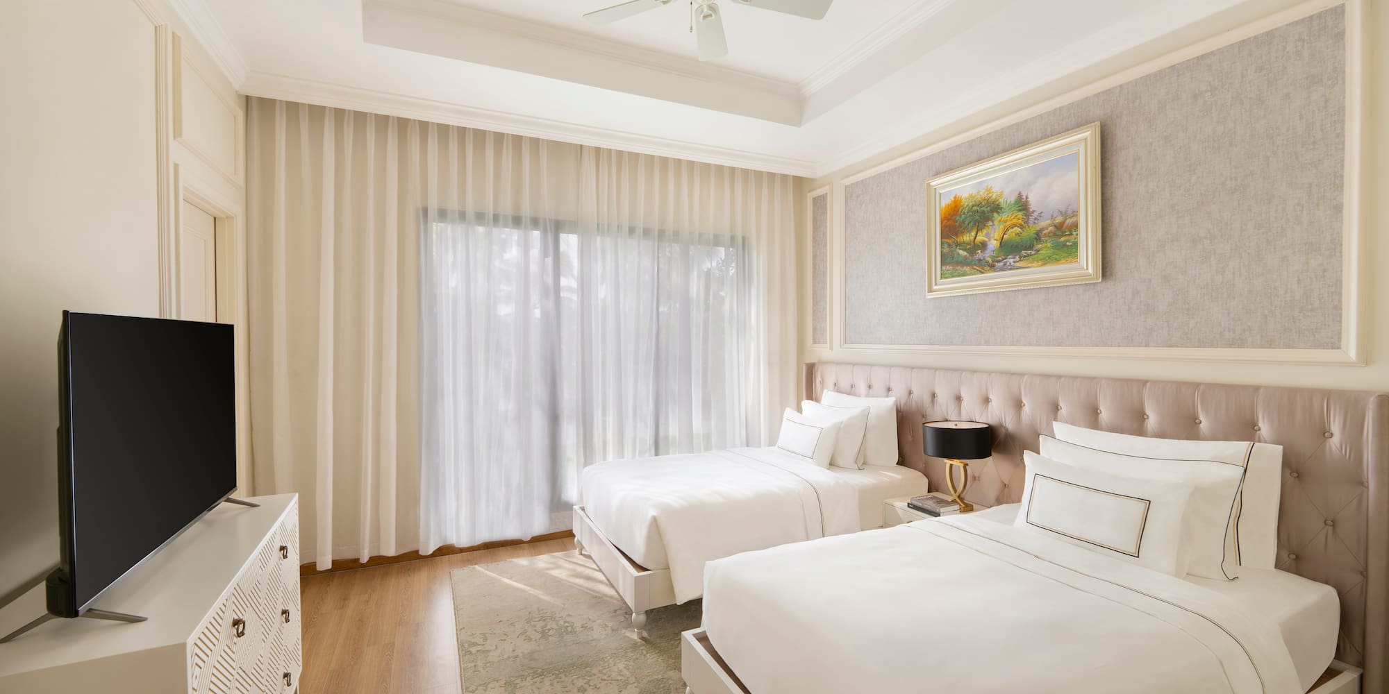 a room with two beds and a tv