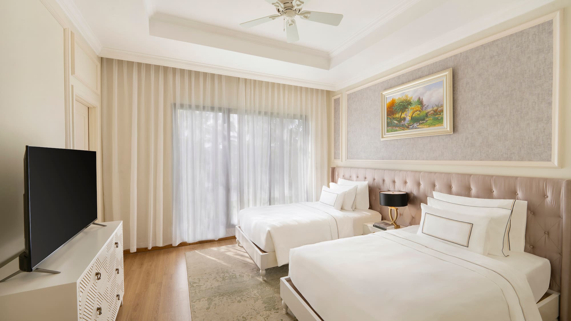 a room with two beds and a tv