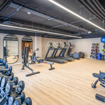 a large gym with exercise equipment