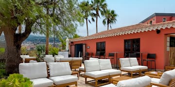 a group of chairs and tables outside a building