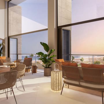 a room with chairs and tables and plants
