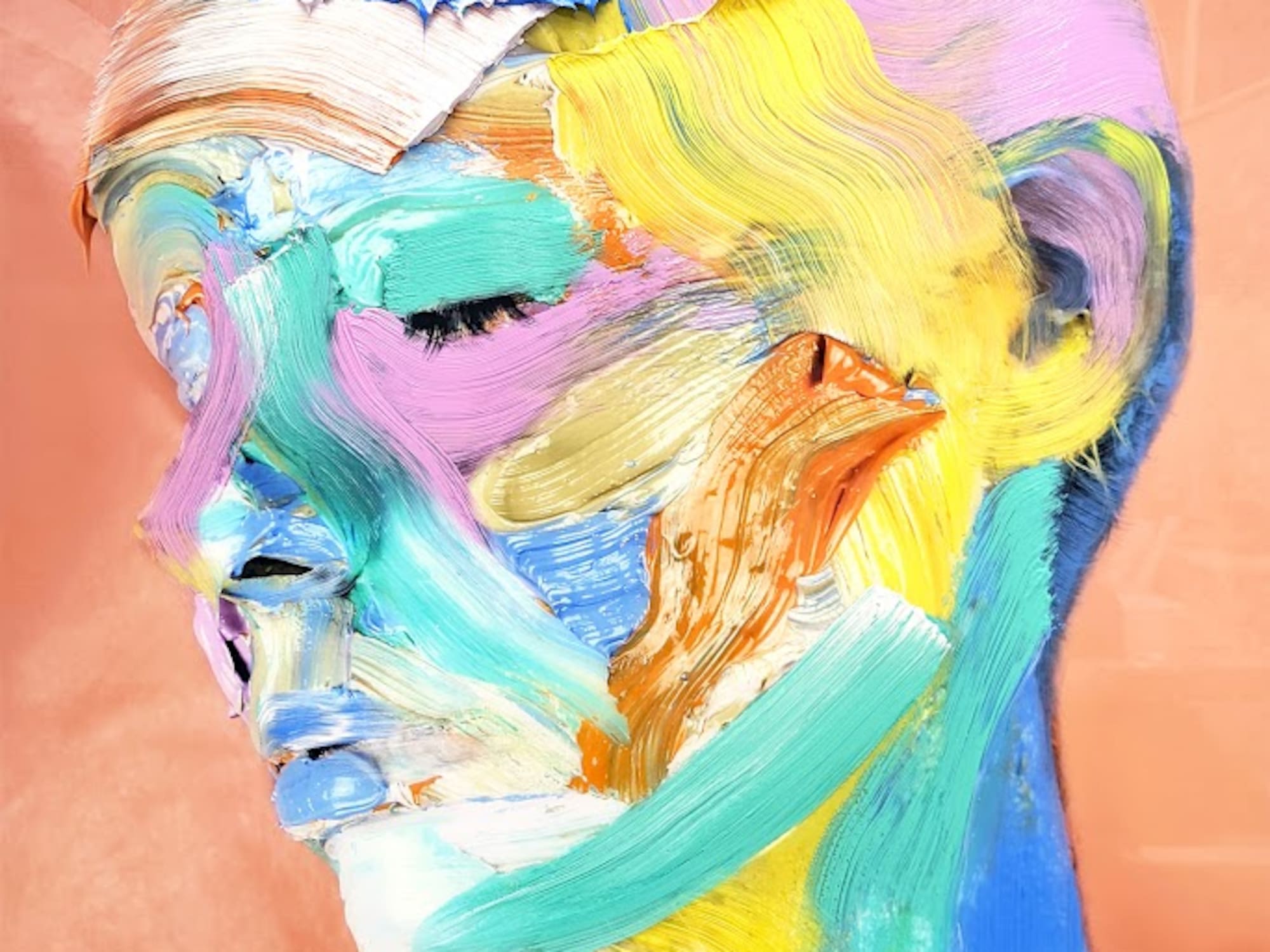 a woman with colorful paint on her face