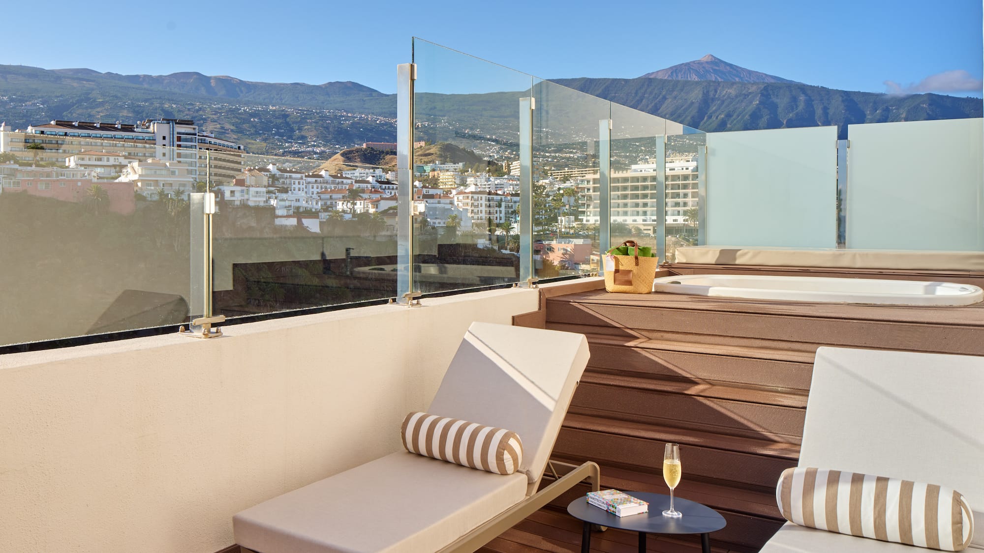 a deck with chairs and a table on it