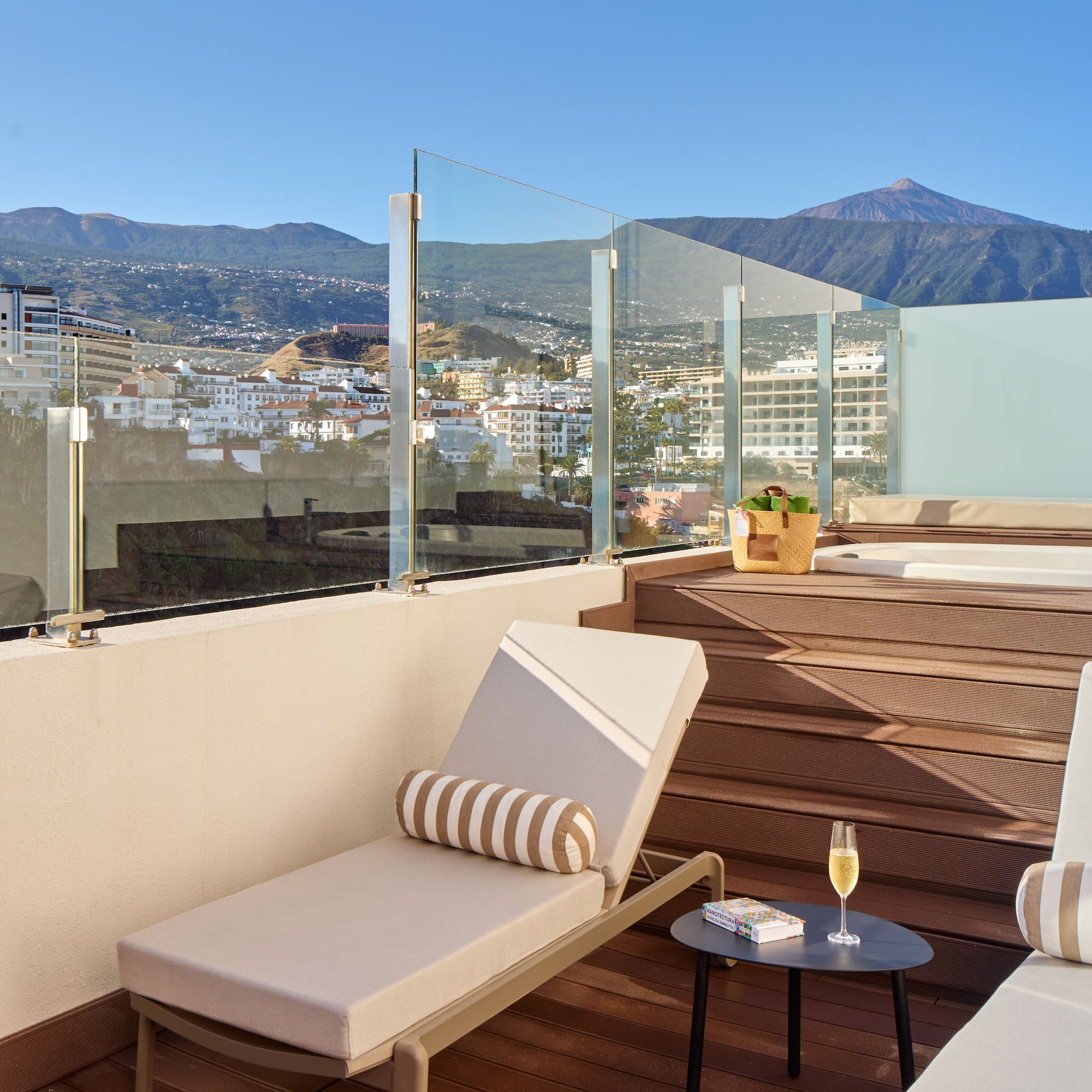 a deck with chairs and a table on it