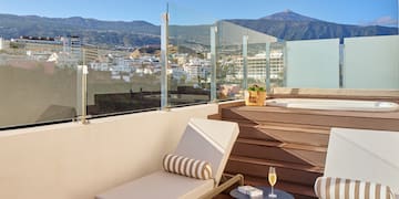 a deck with chairs and a table on it