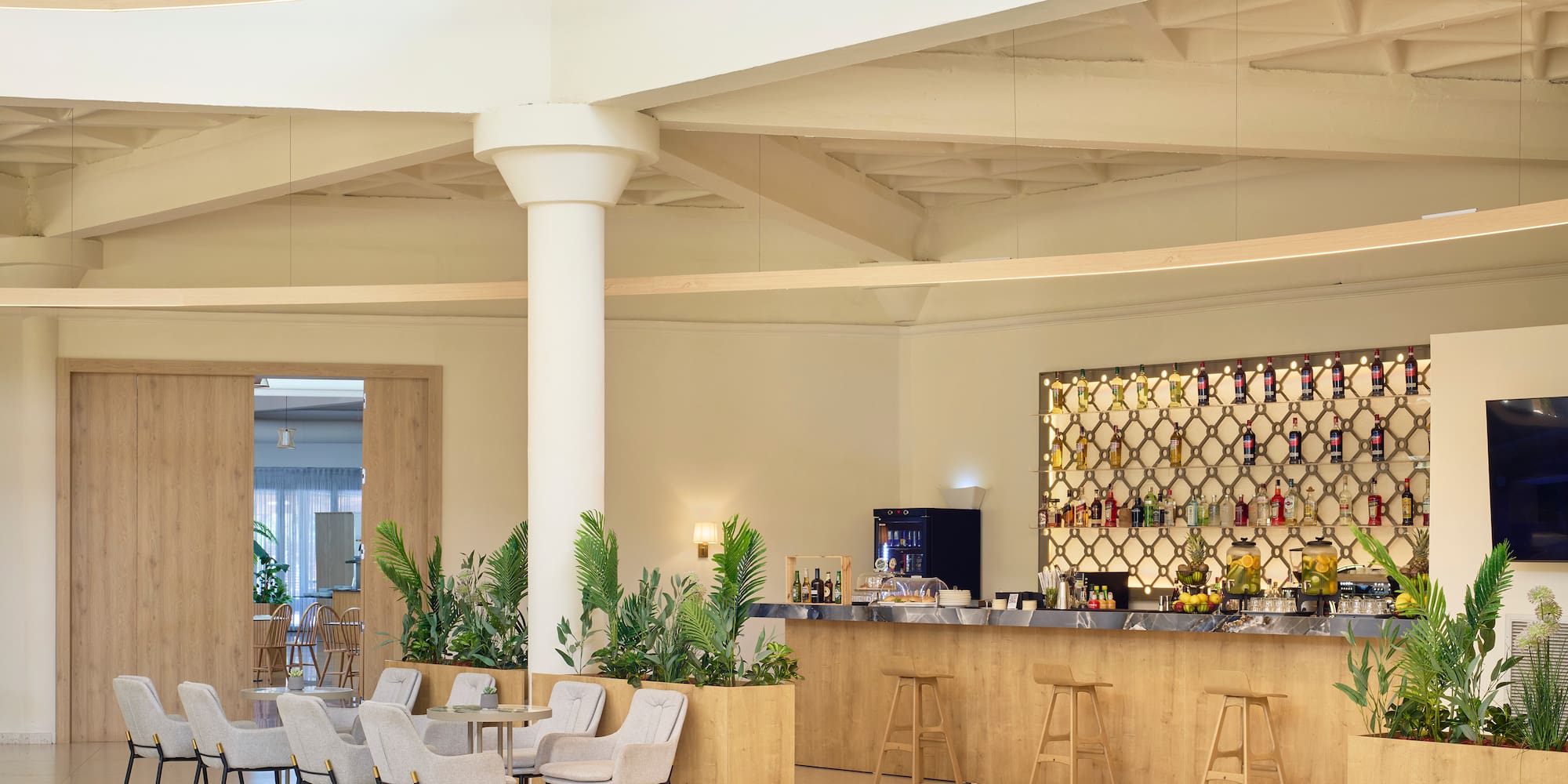 a room with a bar and chairs