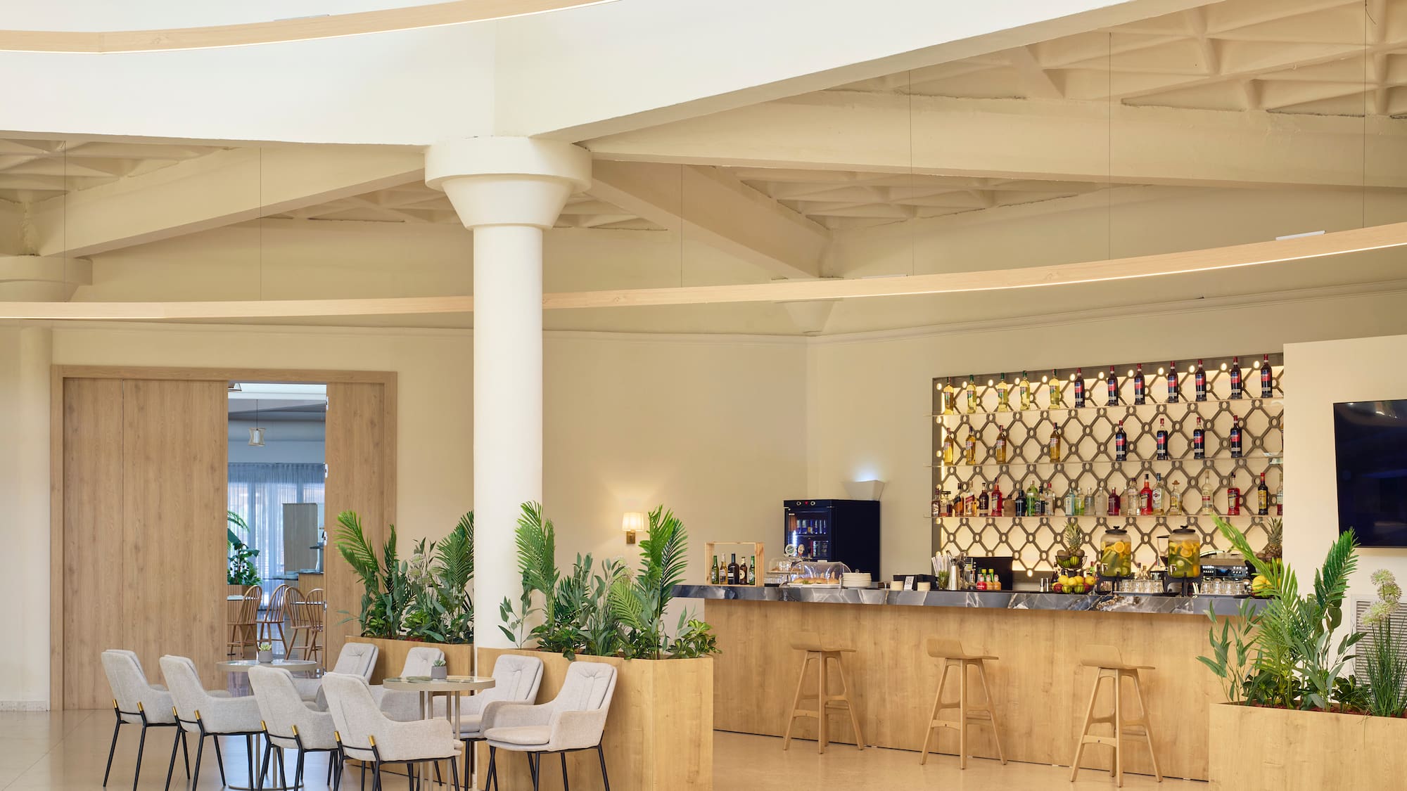 a room with a bar and chairs