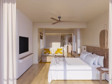 a room with a bed and a television