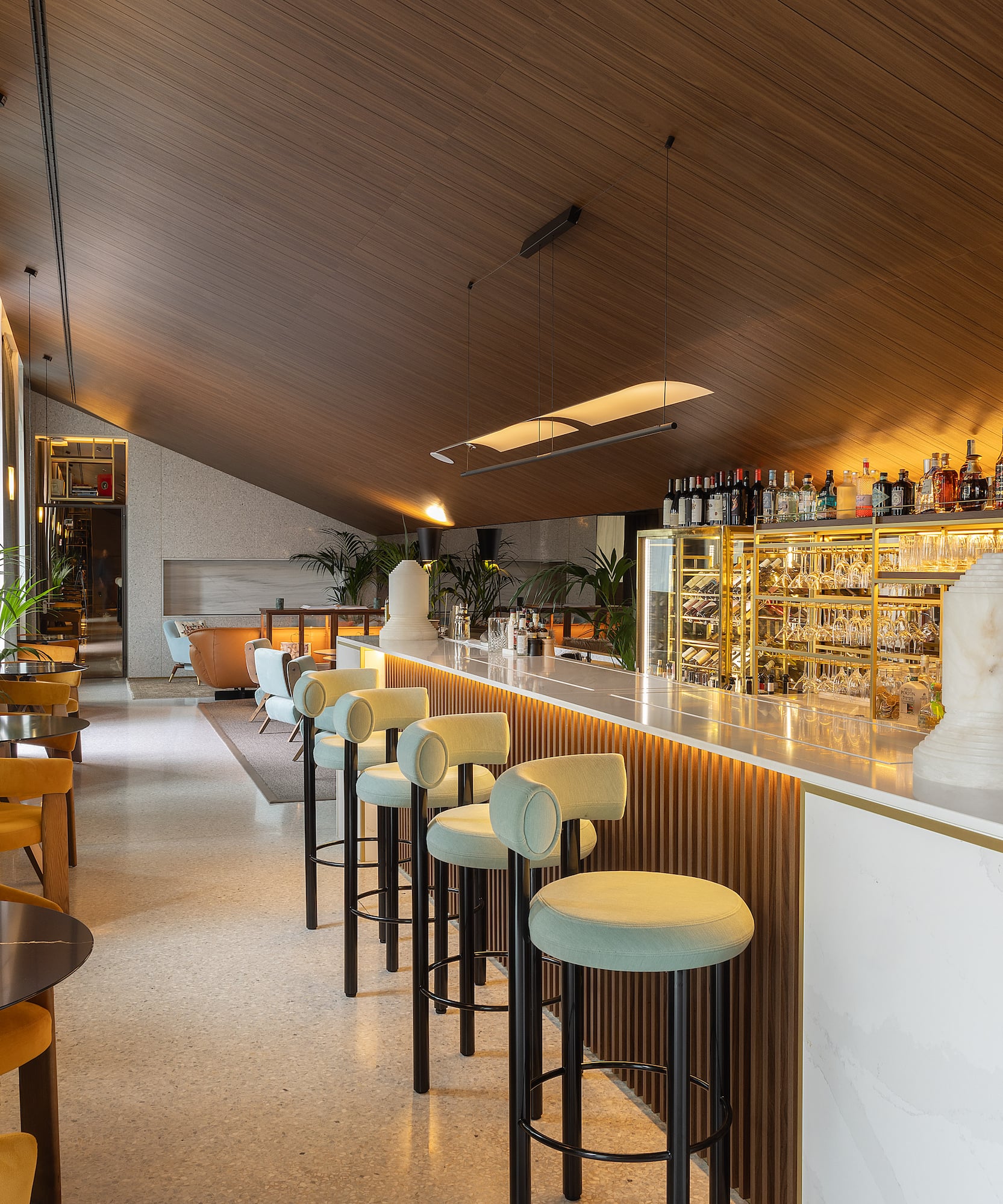 a bar with chairs and tables