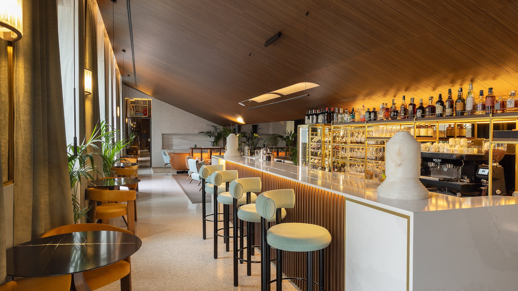 a bar with chairs and tables