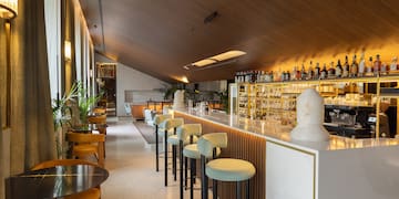 a bar with chairs and tables