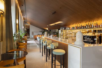 a bar with chairs and tables