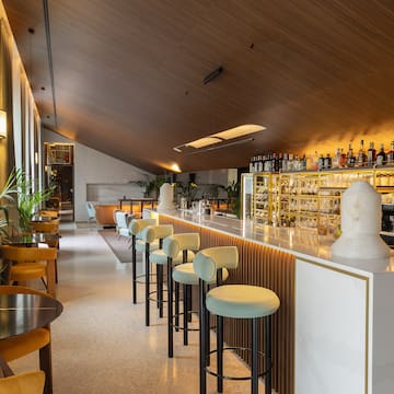 a bar with chairs and tables