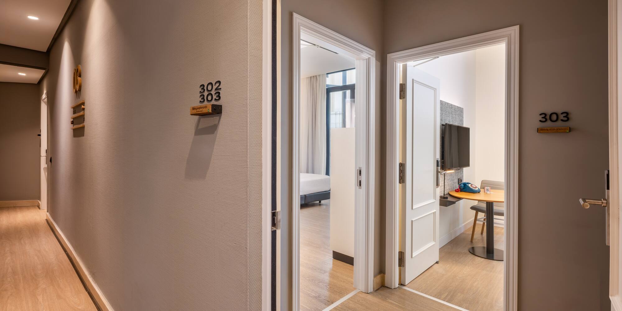 Modern hotel hallway with open doors to guest rooms 302 and 303.