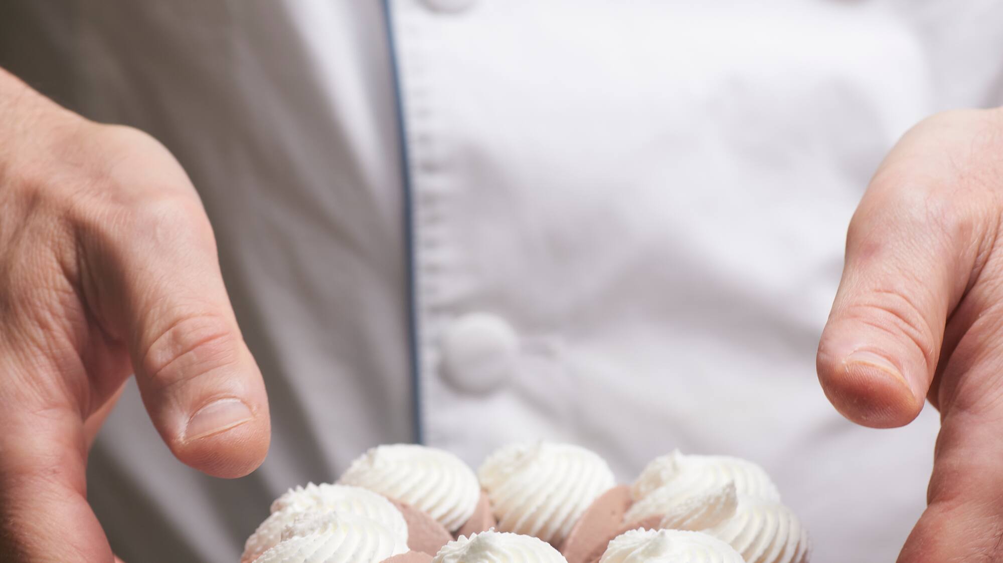 a person holding a pastry