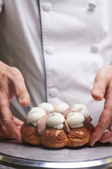 a person holding a pastry