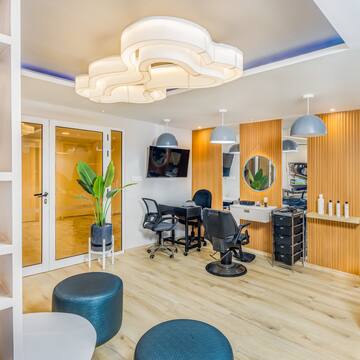 a room with chairs and a mirror