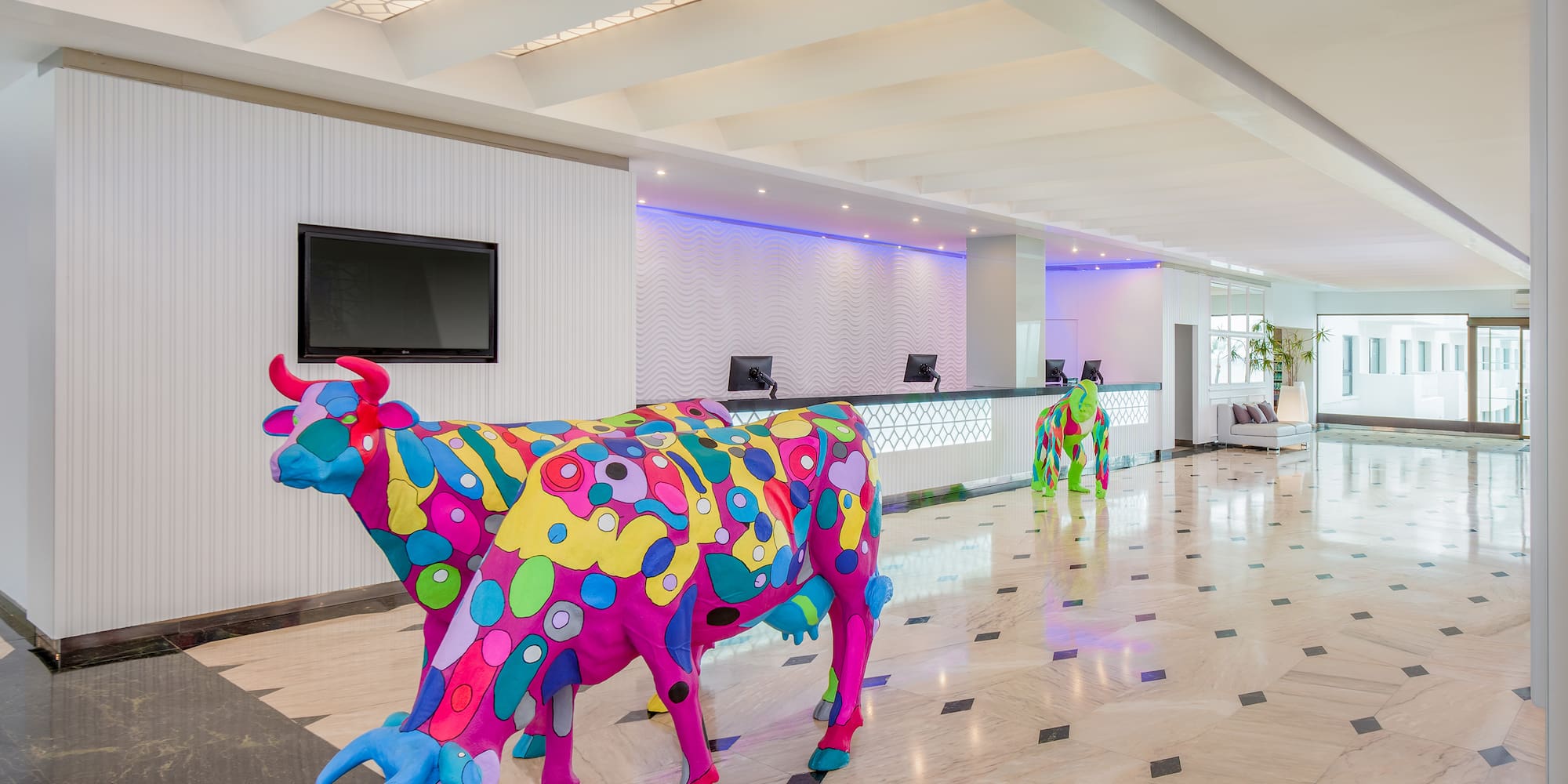 a cow statue in a lobby