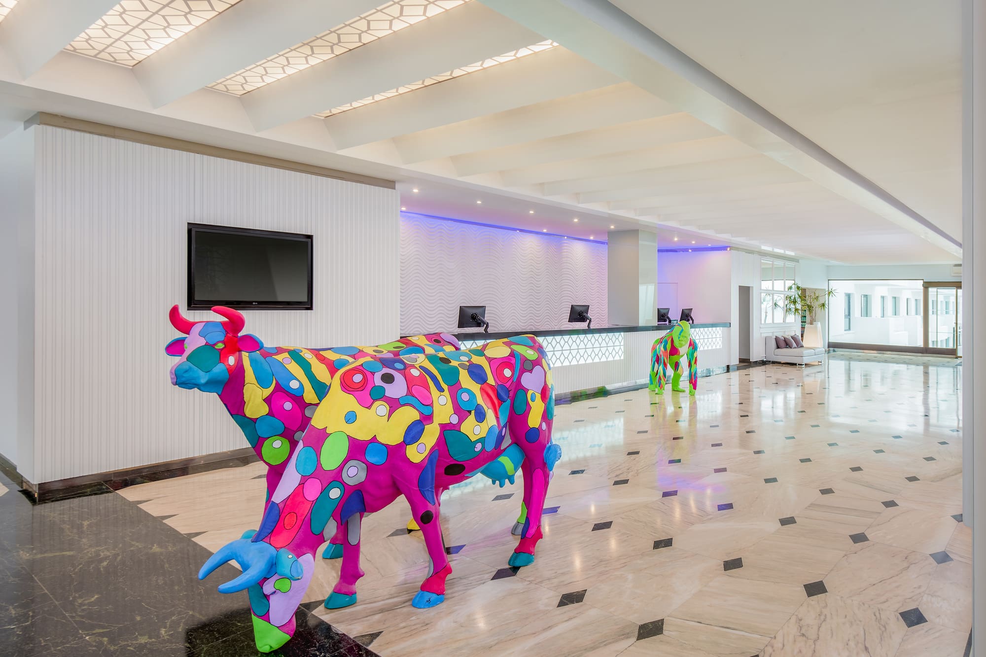 a cow statue in a lobby