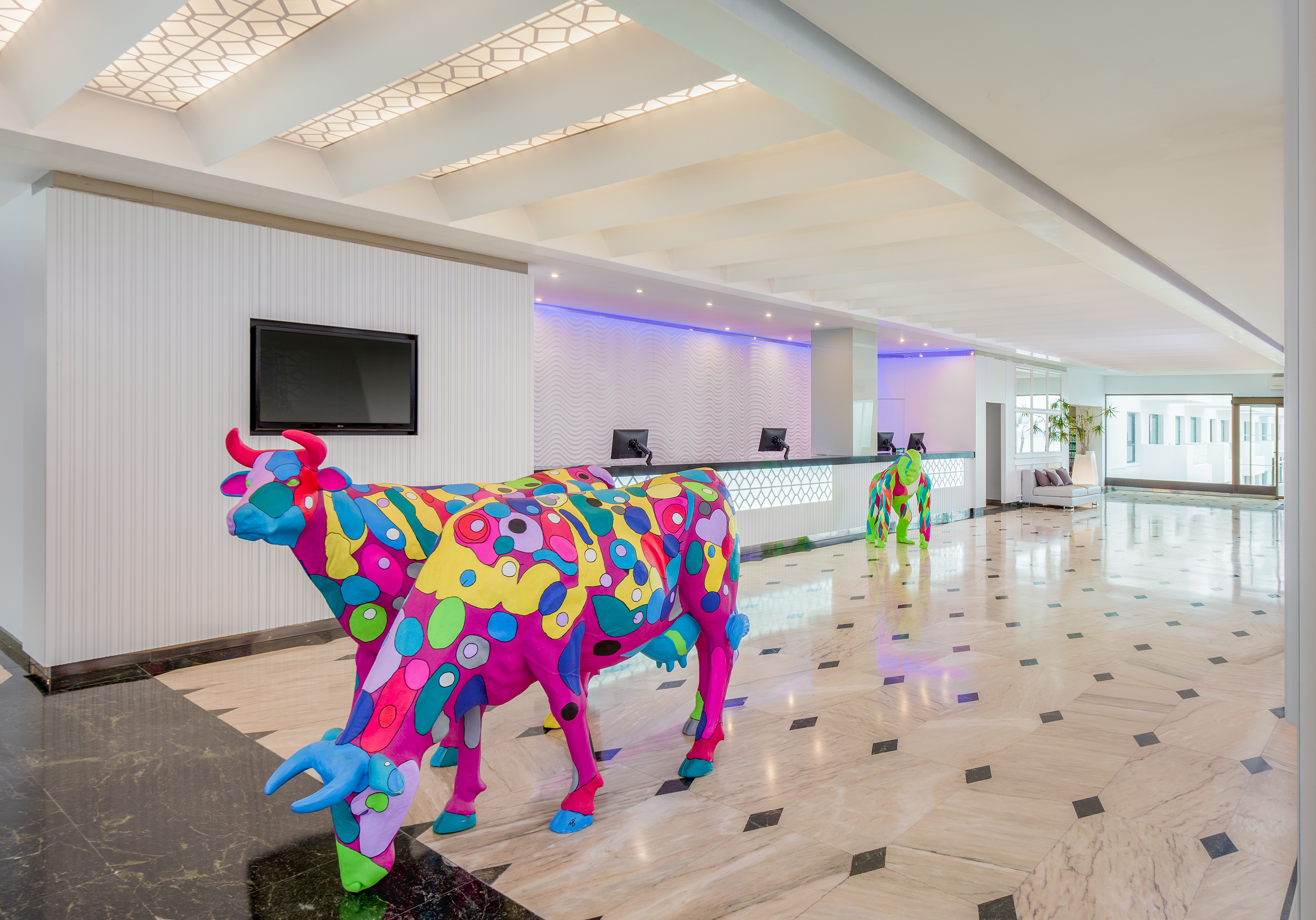a cow statue in a lobby