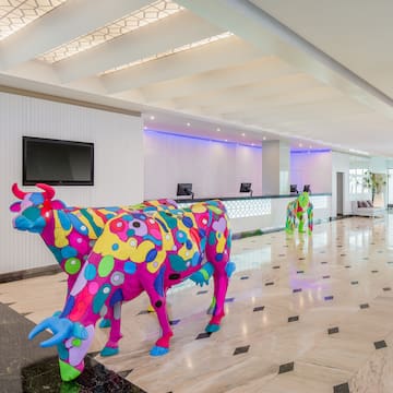 a cow statue in a lobby