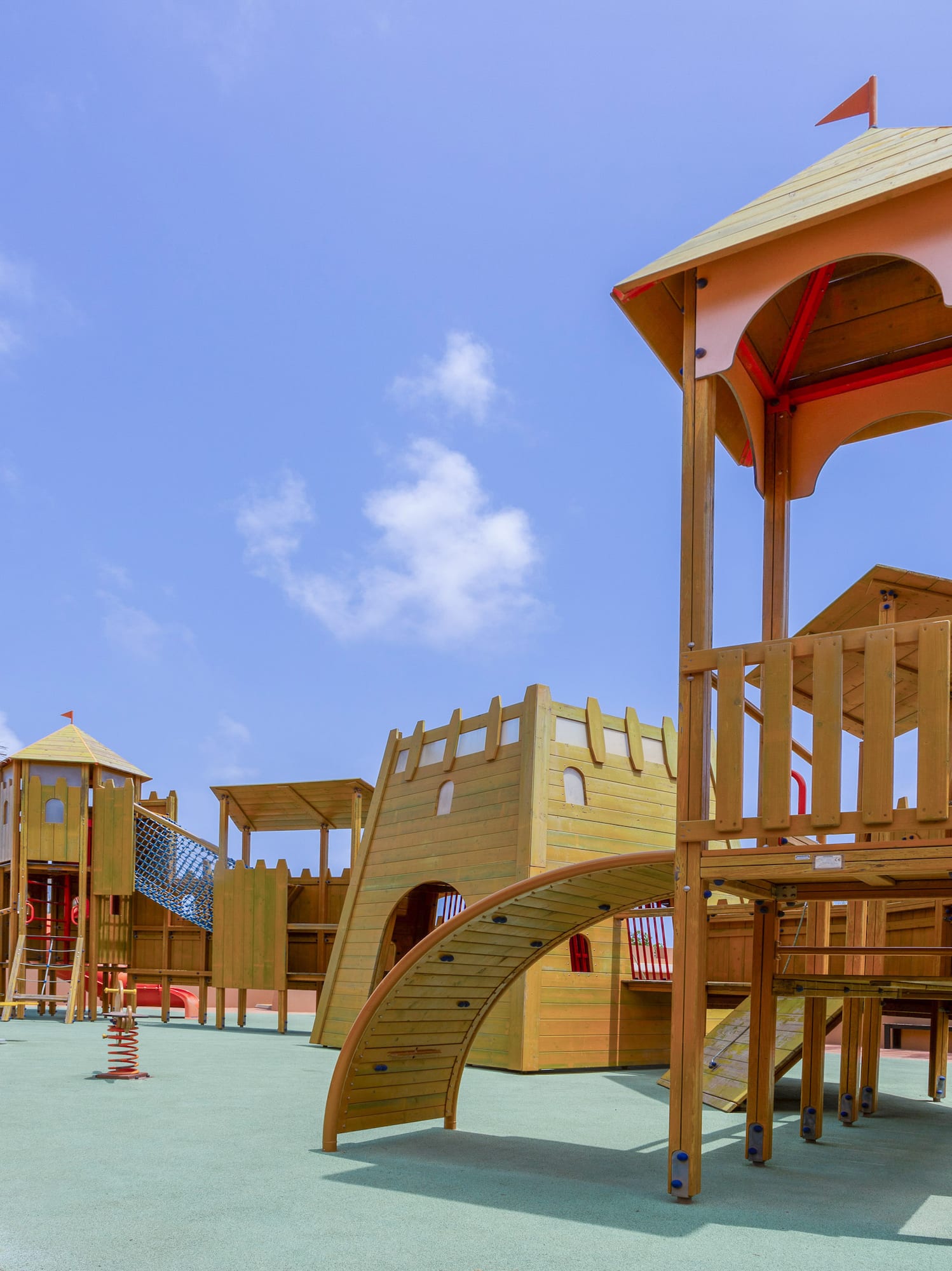 a playground with a structure on the ground