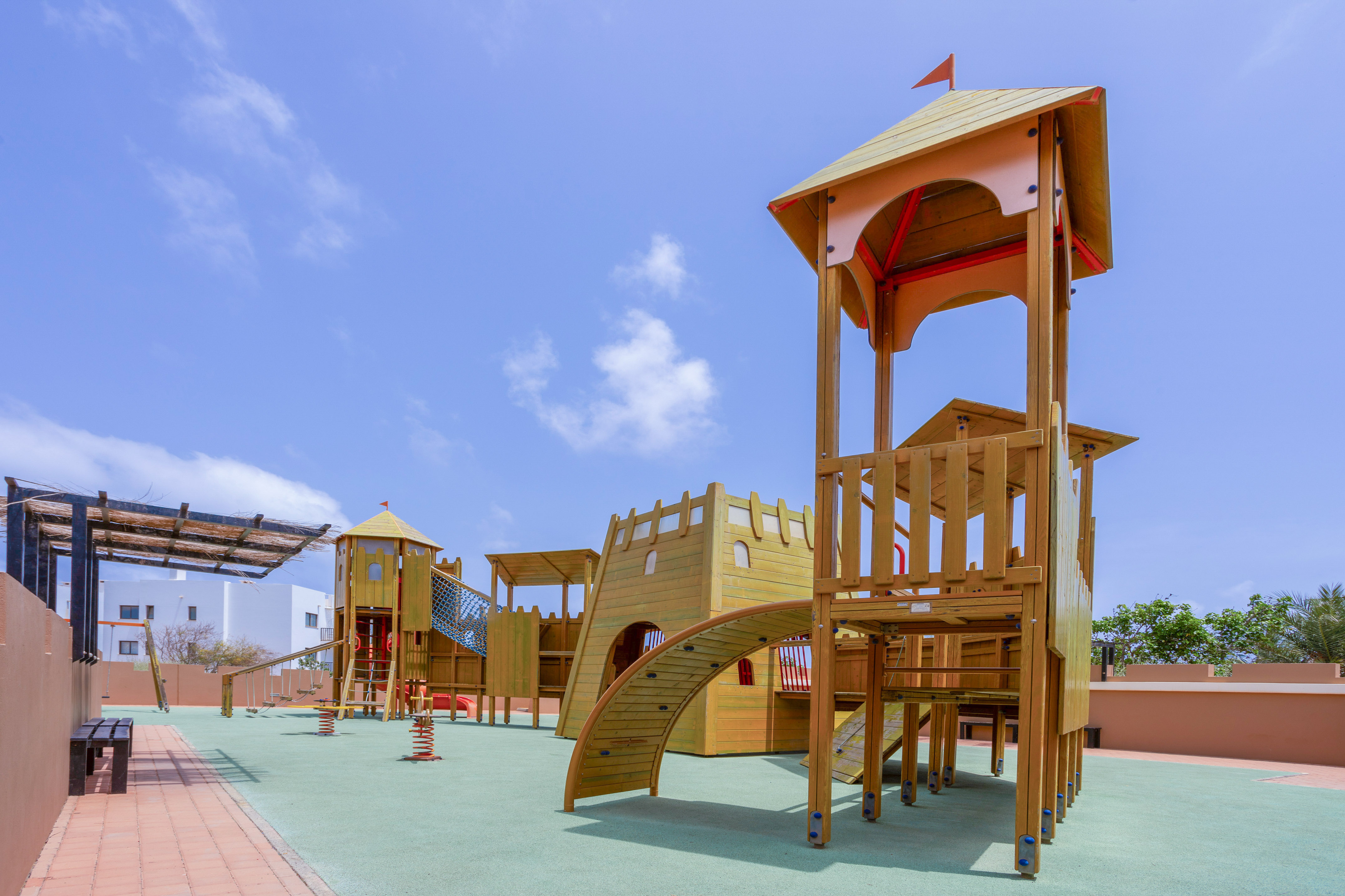 a playground with a structure on the ground