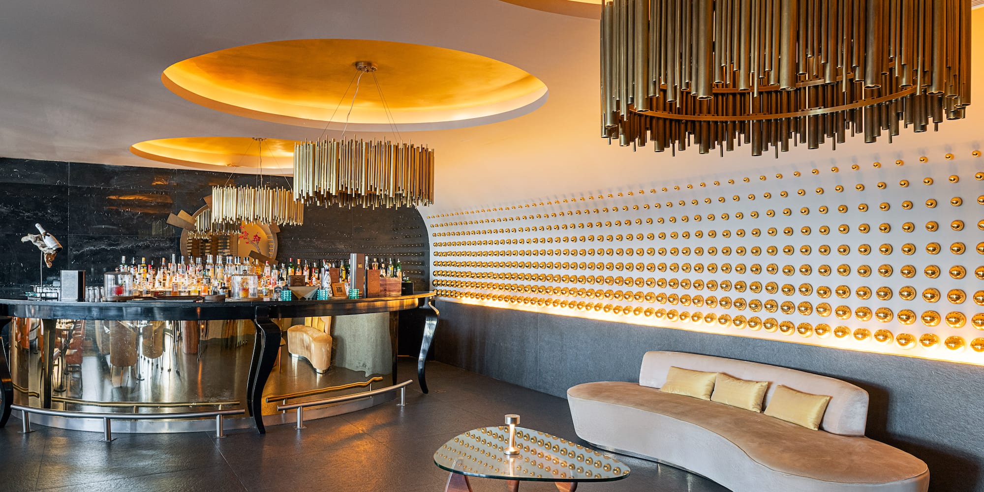 a room with a bar and a couch