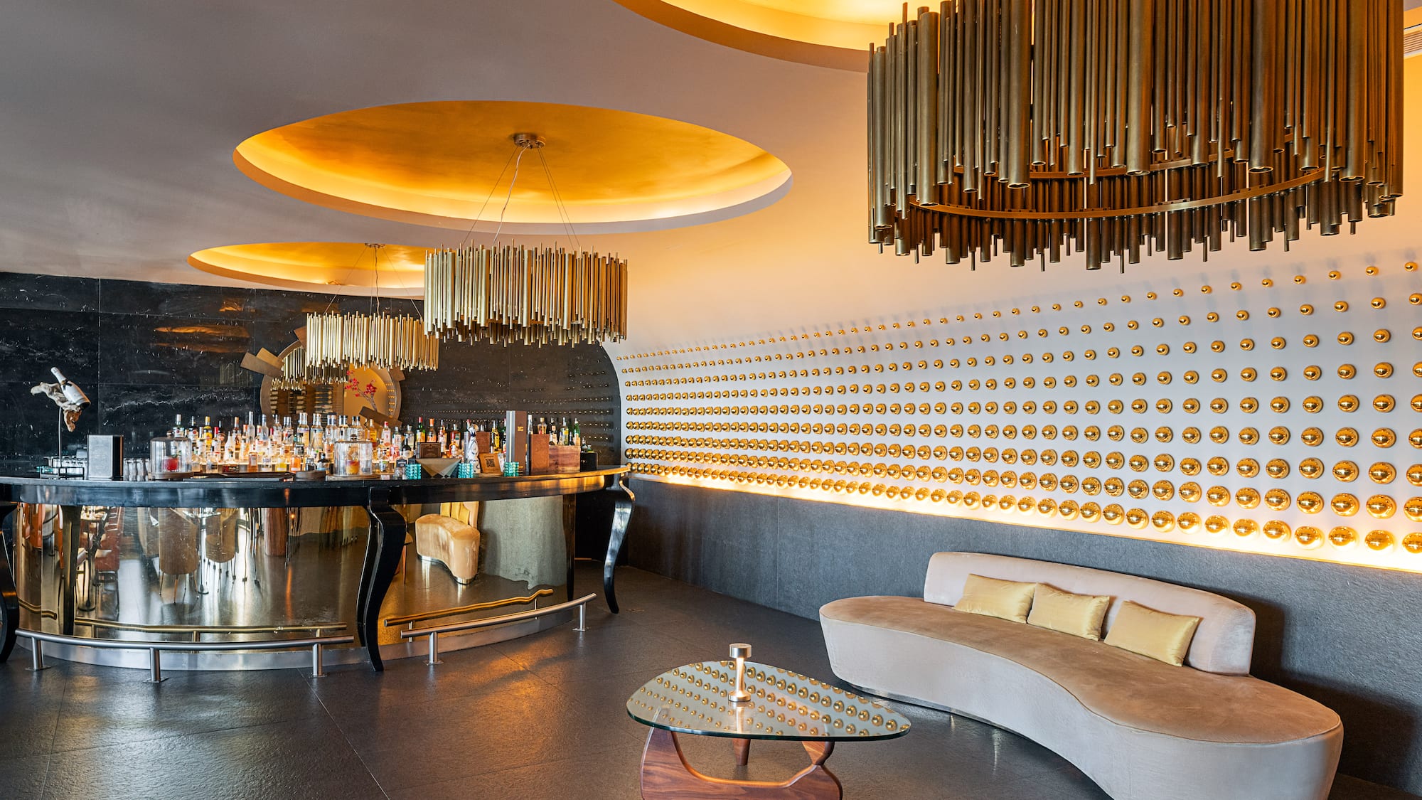 a room with a bar and a couch