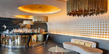 a room with a bar and a couch