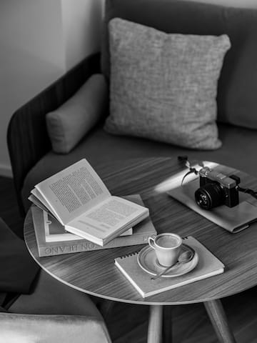 a coffee cup and book on a table