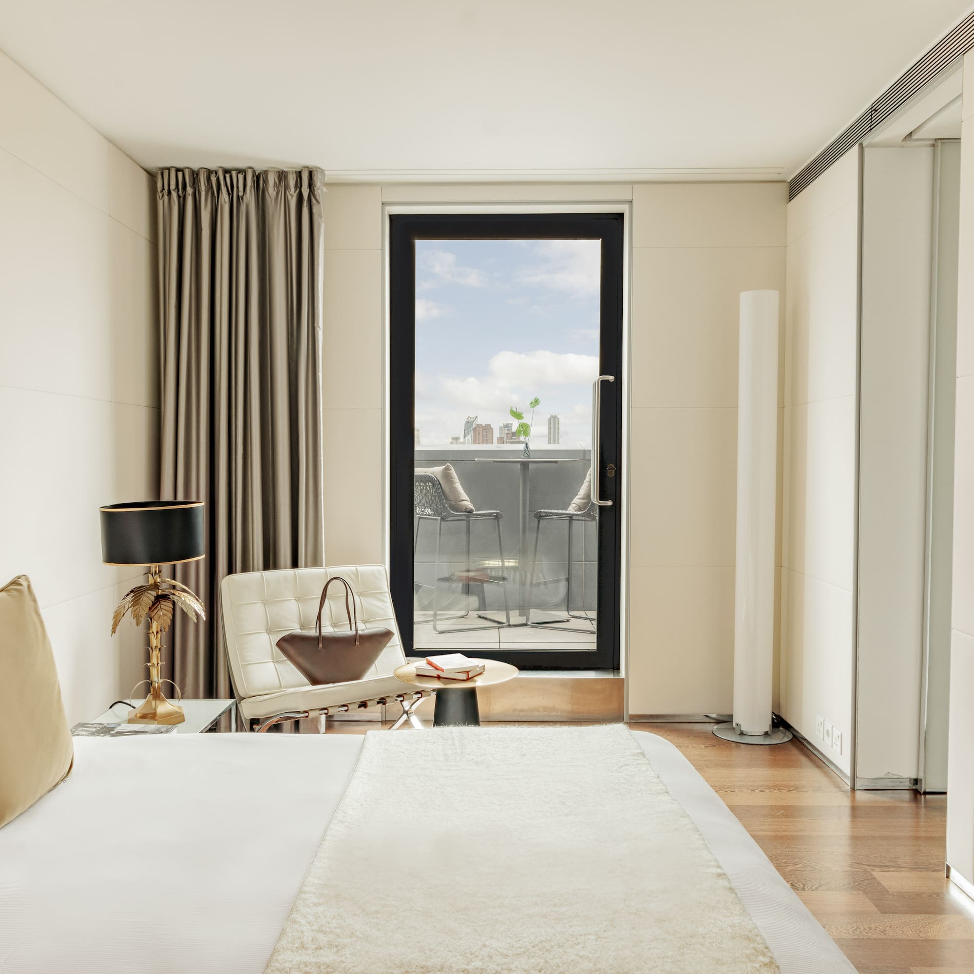 a bedroom with a bed and a chair